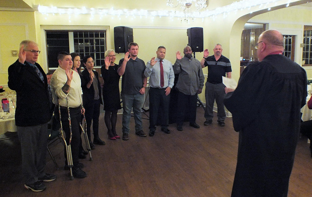 Plattekill Judge Gary Ashdown swore in the Firematic and Social Officers for 2023; L-R Ricky Brooks, Deanna Leon, Sherri Mackey, Melissa Leon, Patti Brooks, Zach Adolphsen, Phil Sabarese, Jack Lunsford and Jeremy Nash.